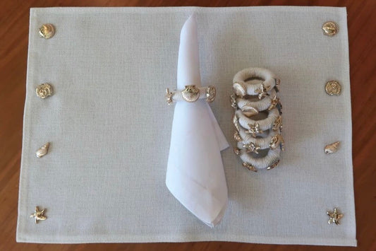 Mantel conchitas doradas